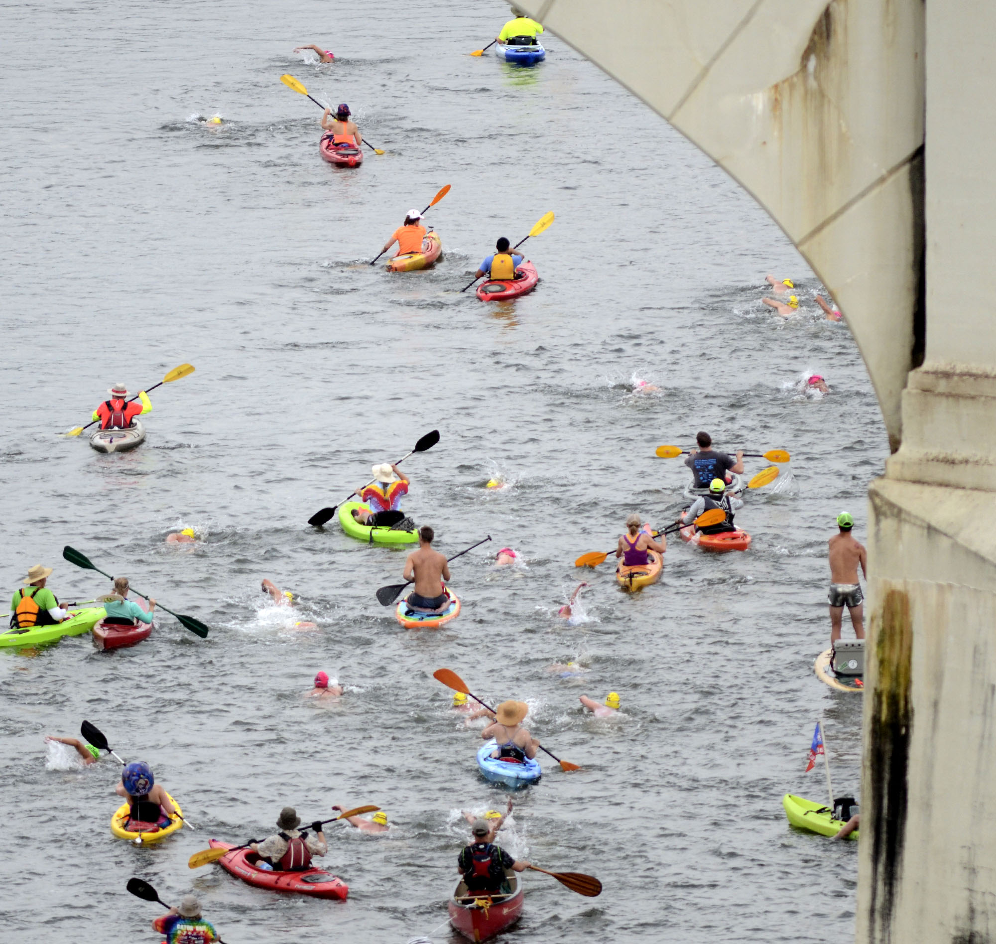 Swimmers and their volunteer pilots head downstream past the Market Tree Bridge. The final day of the 2017 U.S. Masters Swimming Middle and Ultramarathon Distance Open Water National Championships was held on the Tennessee River on June 4, 2017.