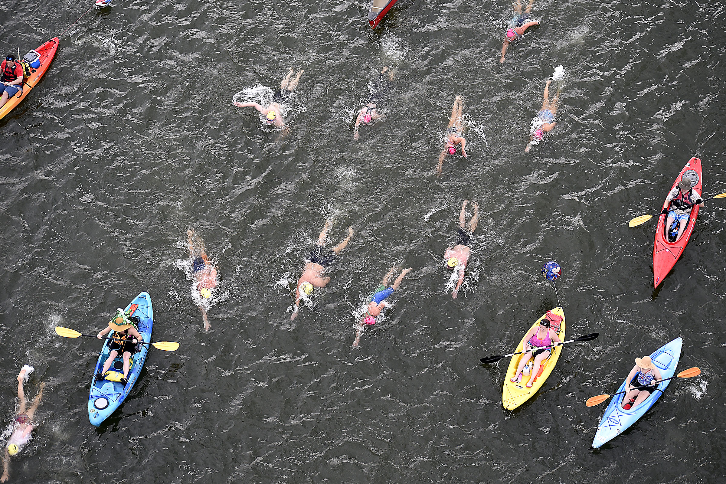 A group of the swimmers and their volunteer pilots prepare to pass under the Walnut Street Bridge. The final day of the 2017 U.S. Masters Swimming Middle and Ultramarathon Distance Open Water National Championships was held on the Tennessee River on June 4, 2017.