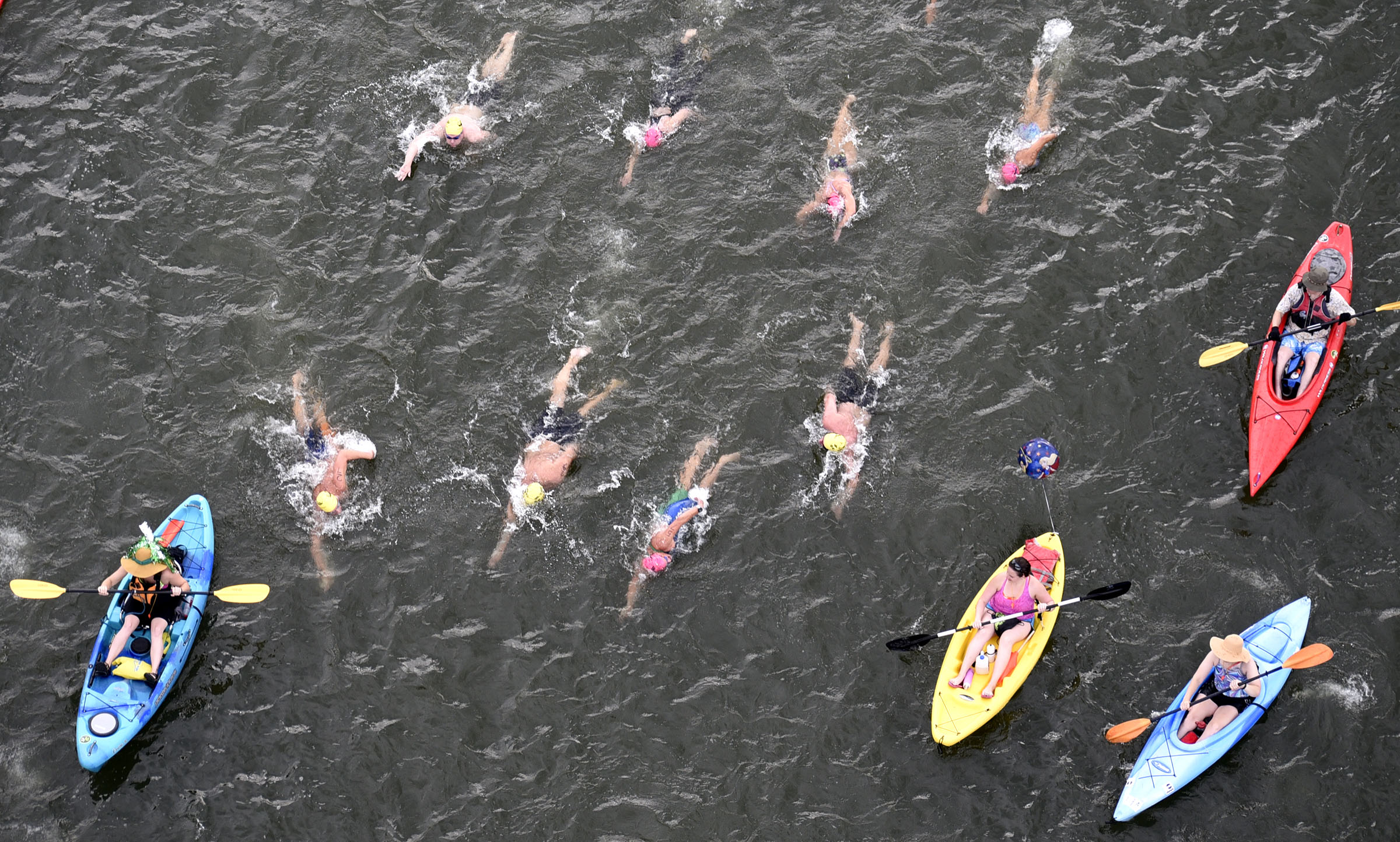 A group of the swimmers and their volunteer pilots prepare to pass under the Walnut Street Bridge. The final day of the 2017 U.S. Masters Swimming Middle and Ultramarathon Distance Open Water National Championships was held on the Tennessee River on June 4, 2017.