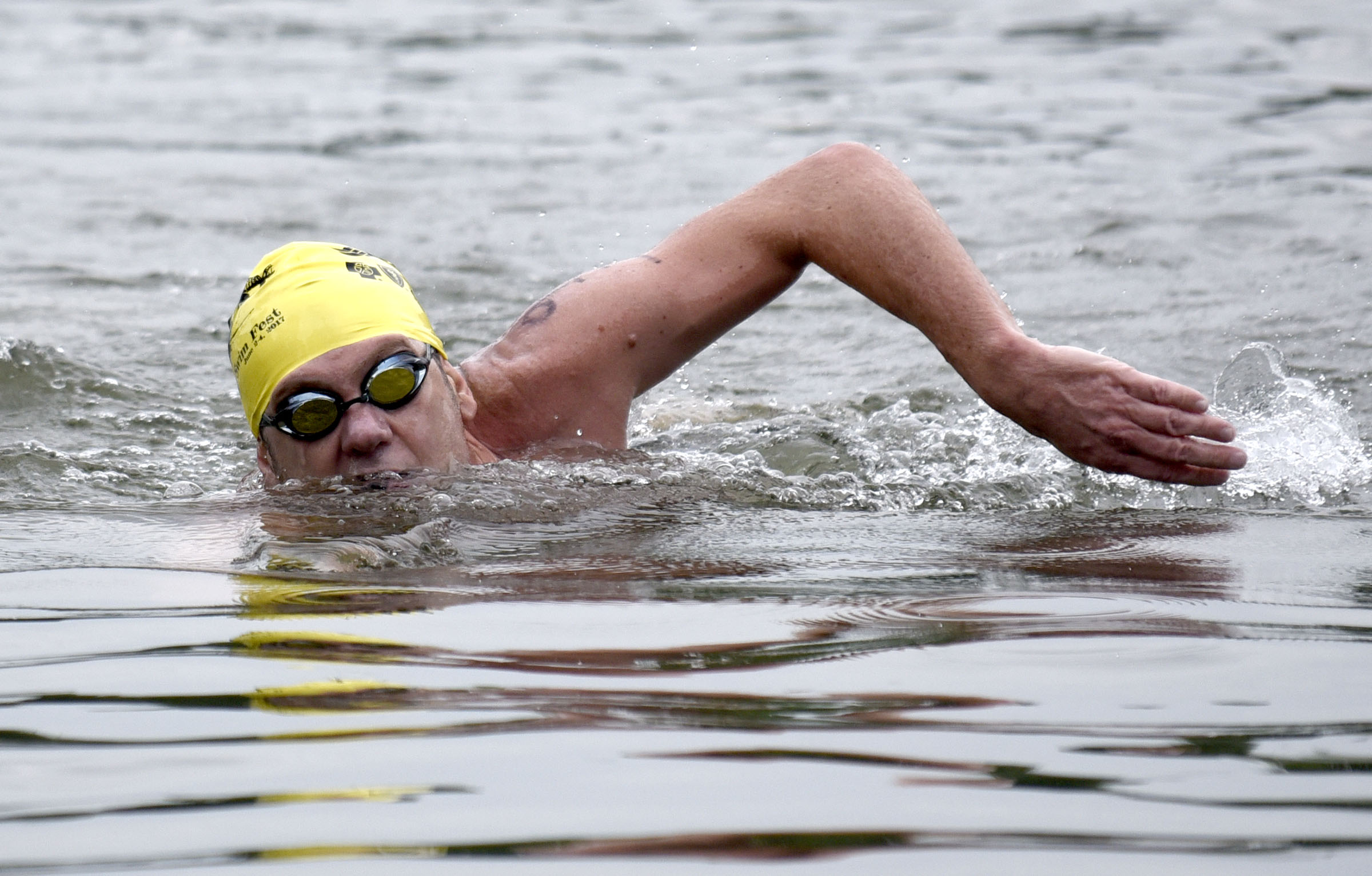 Male winner, Richardo Valdivia of Miami, Florida, swims to the finish line at Baylor School. The final day of the 2017 U.S. Masters Swimming Middle and Ultramarathon Distance Open Water National Championships was held on the Tennessee River on June 4, 2017.