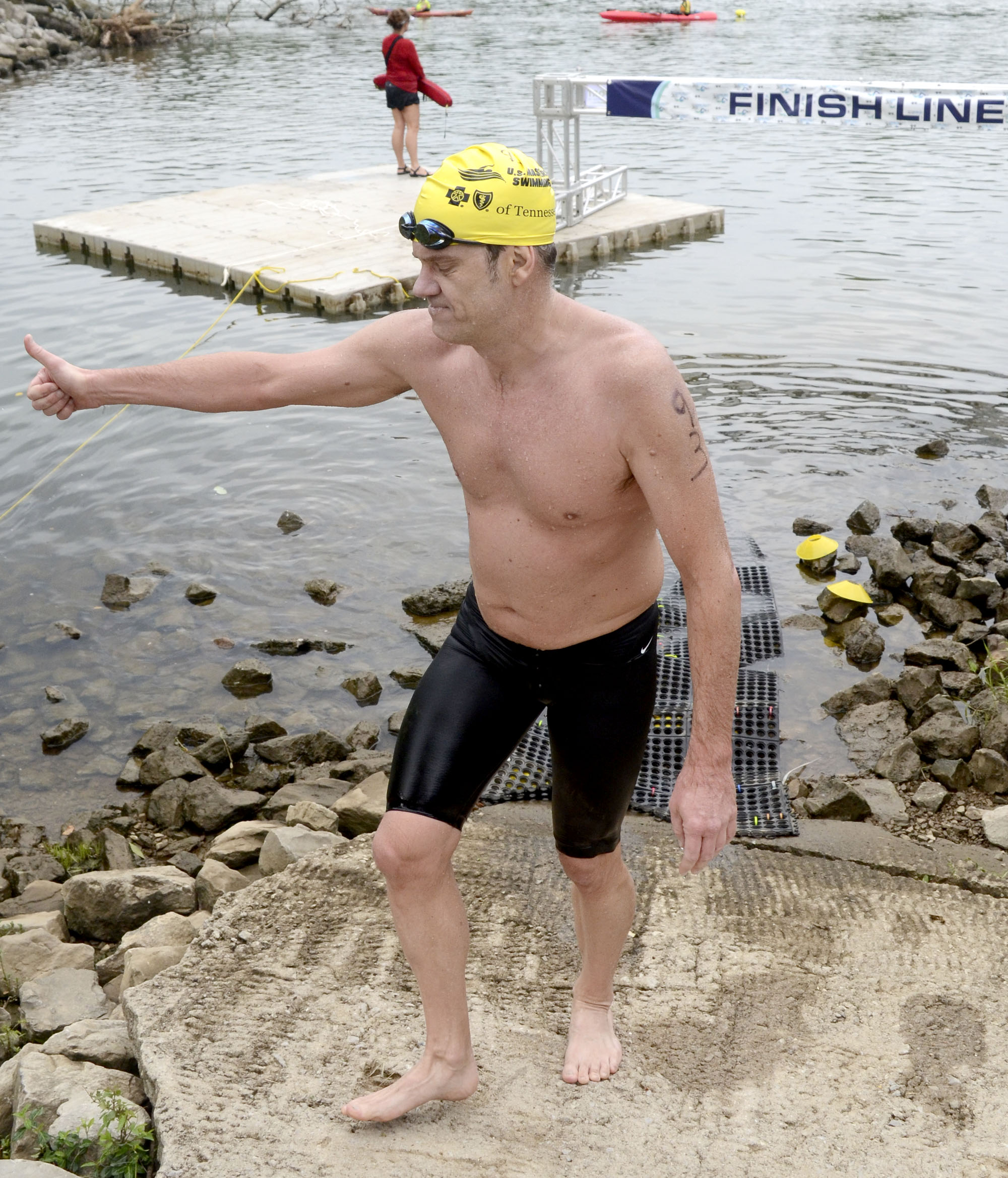 Male winner, Richardo Valdivia of Miami, Florida, gives a thumbs-up after crossing the finish line at Baylor School. The final day of the 2017 U.S. Masters Swimming Middle and Ultramarathon Distance Open Water National Championships was held on the Tennessee River on June 4, 2017.