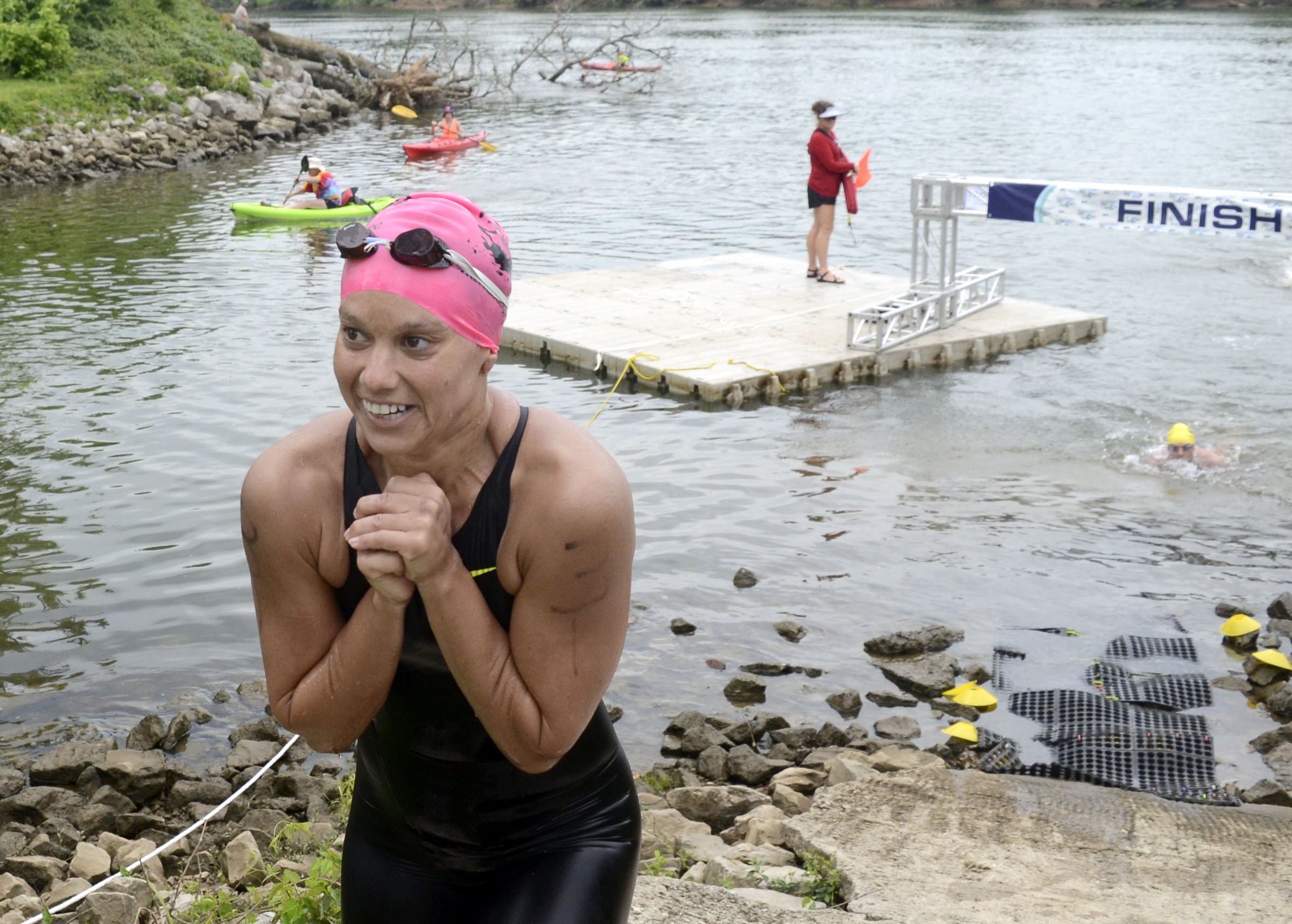 Female winner, Sandra Frimerman-Bergquist of Excelsior, Minnesota, smiles after crossing the finish line at Baylor School. The final day of the 2017 U.S. Masters Swimming Middle and Ultramarathon Distance Open Water National Championships was held on the Tennessee River on June 4, 2017.