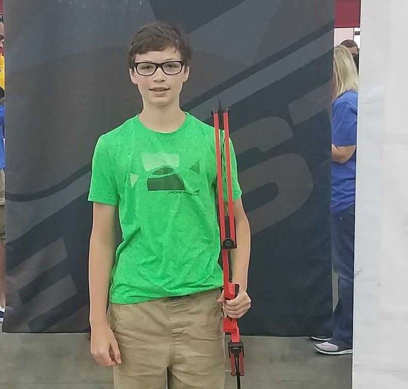 Caden Gilley stands with his bow at the National Archery in the Schools Program National Competition. (Contributed photo)