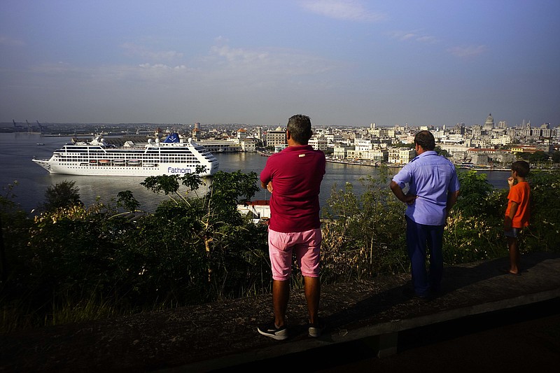 FILE - In this May 2, 2016 file photo, people watch the Carnival Adonia cruise ship arrive from Miami, in Havana, Cuba. As the Trump administration prepares to announce changes — probably rollbacks — in U.S - Cuba renewed relations policies initiated by Barack Obama. (AP Photo/Ramon Espinosa, File)