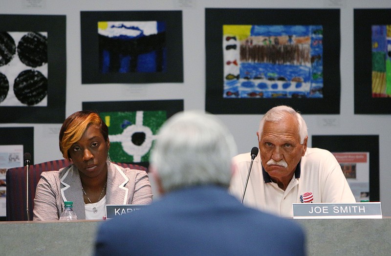 Hamilton County School Board members Karitsa Mosley Jones and Joe Smith listen to Dr. Wayne Johnson, a candidate for Hamilton County Superintendent of Schools, as he responds to questions during an interview for the superintendent position at the Hamilton County Board of Education on Mon., June 5, 2017. Johnson's background is in business, but he sees being a nontraditional candidate as a positive thing.