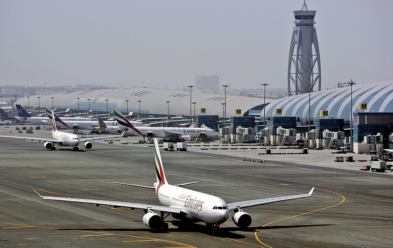 
              FILE - In April 20, 2010 file photo, an Emirates airline passenger jet taxis on the tarmac at Dubai International airport in Dubai, United Arab Emirates. Emirates said it is suspending flights to Qatar amid a growing diplomatic rift. The airline said on its website Monday, June 5, 2017, that flights would be suspended until further notice starting Tuesday. (AP Photo/Kamran Jebreili, File)
            