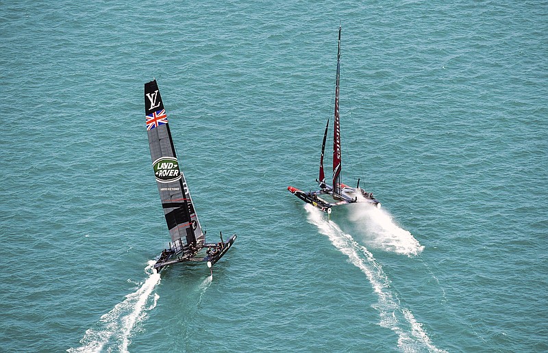 
              In this photo provided by America's Cup Event Authority, Emirates Team New Zealand and Great Britain's Land Rover BAR compete compete during America's Cup challenger semifinals on the Great Sound in Bermuda on Monday, June 5, 2017.  (Ricardo Pinto/ACEA via AP)
            