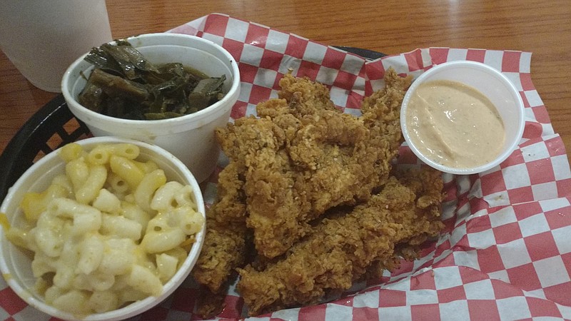 The three chicken tender plate served with Henpecked sauce, pepper jack mac and cheese and collard greens.