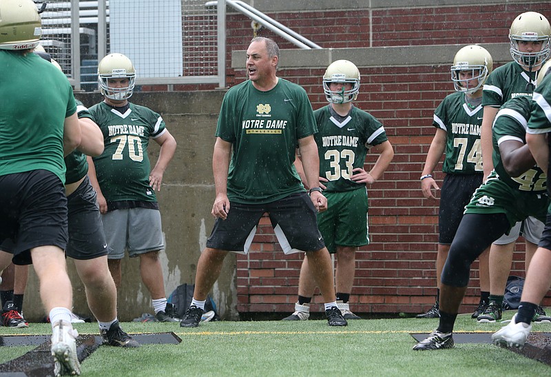 Jeff Jagodzinski works with Notre Dame football players during practice at Finley Stadium in Chattanooga, Tenn., on Mon., June 5, 2017. Notre Dame hired the former coach of Boston College to be their offensive line coach.