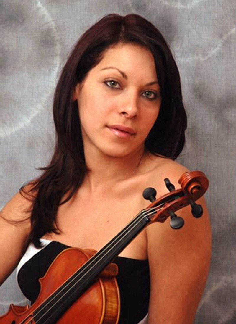
              This undated publicity photo provided by her attorney, Philip A. MacNaughton, shows professional violinist Yennifer Correia in Venezuela. United Airlines says it wants to contact Correia, who says she was barred by a United supervisor from boarding a plane with her violin on Sunday, June 4, 2017, in Houston, leading to a scuffle that caused her to miss her flight and she thinks may have injured her hand. Correia and her attorney say the scuffle happened as the Memphis musician was preparing to fly to Missouri for a symphony rehearsal. (Yennifer Correia/Philip A. MacNaughton via AP)
            