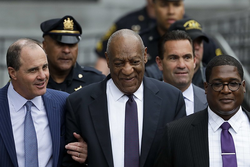 
              Bill Cosby walks from the Montgomery County Courthouse during his sexual assault trial, Tuesday, June 6, 2017, in Norristown, Pa. (AP Photo/Matt Slocum)
            