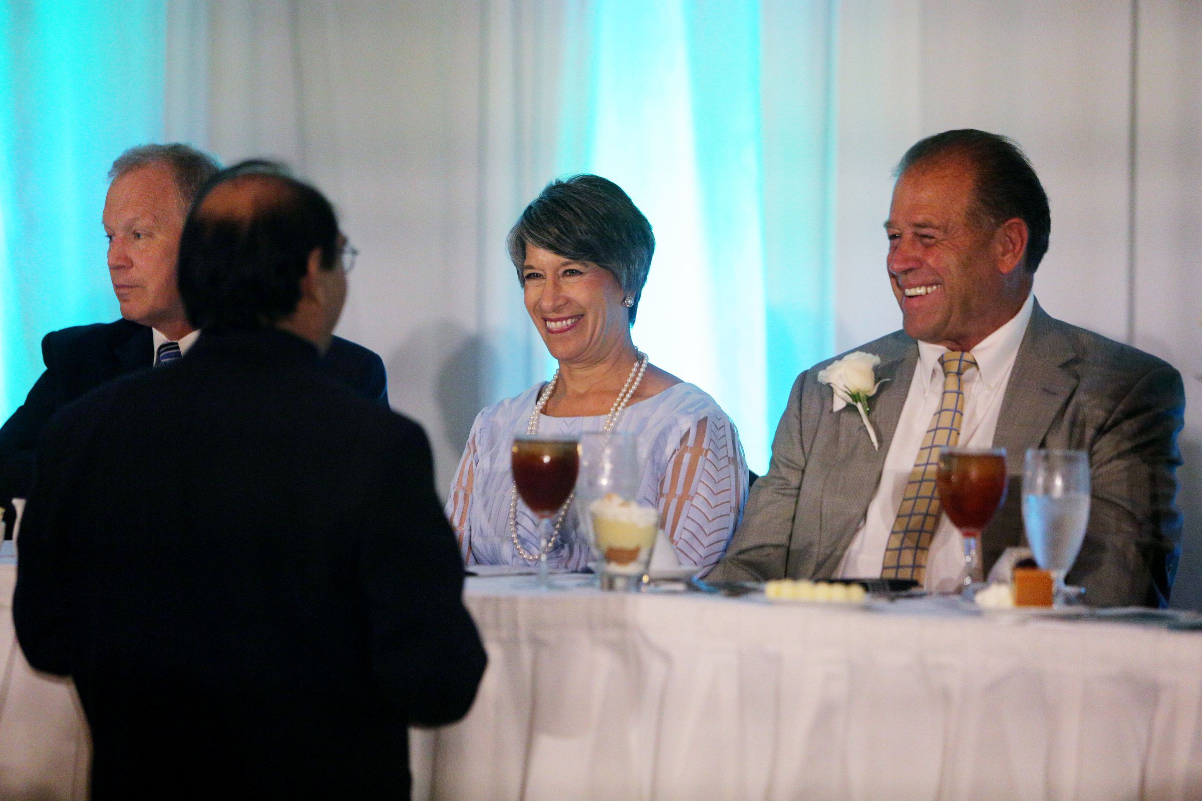 Ron Bhalla speaks with Julie Baumgardner, president and CEO of First things First, and Emerson Russell, the 2016 Chattanooga Area Manager of the Year, during a luncheon at the Chattanoogan in Chattanooga, Tenn., on Wednesday, June 7, 2017. Baumgardner was named the 2017 Chattanooga Area Manager of the Year.