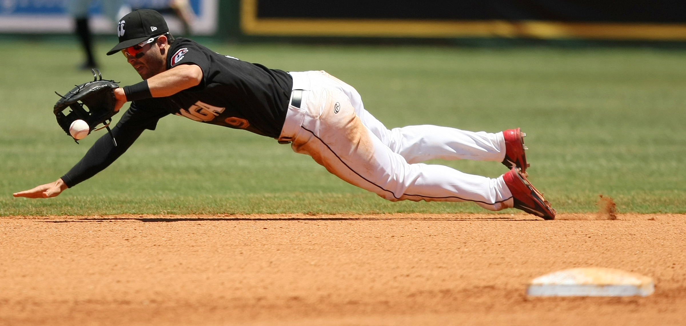 Chattanooga Lookouts second baseman Levi Michael (9) makes a diving stop against the Jackson Generals in the top of the seventh inning at AT&T Field on Wednesday, June 7, in Chattanooga, Tenn.