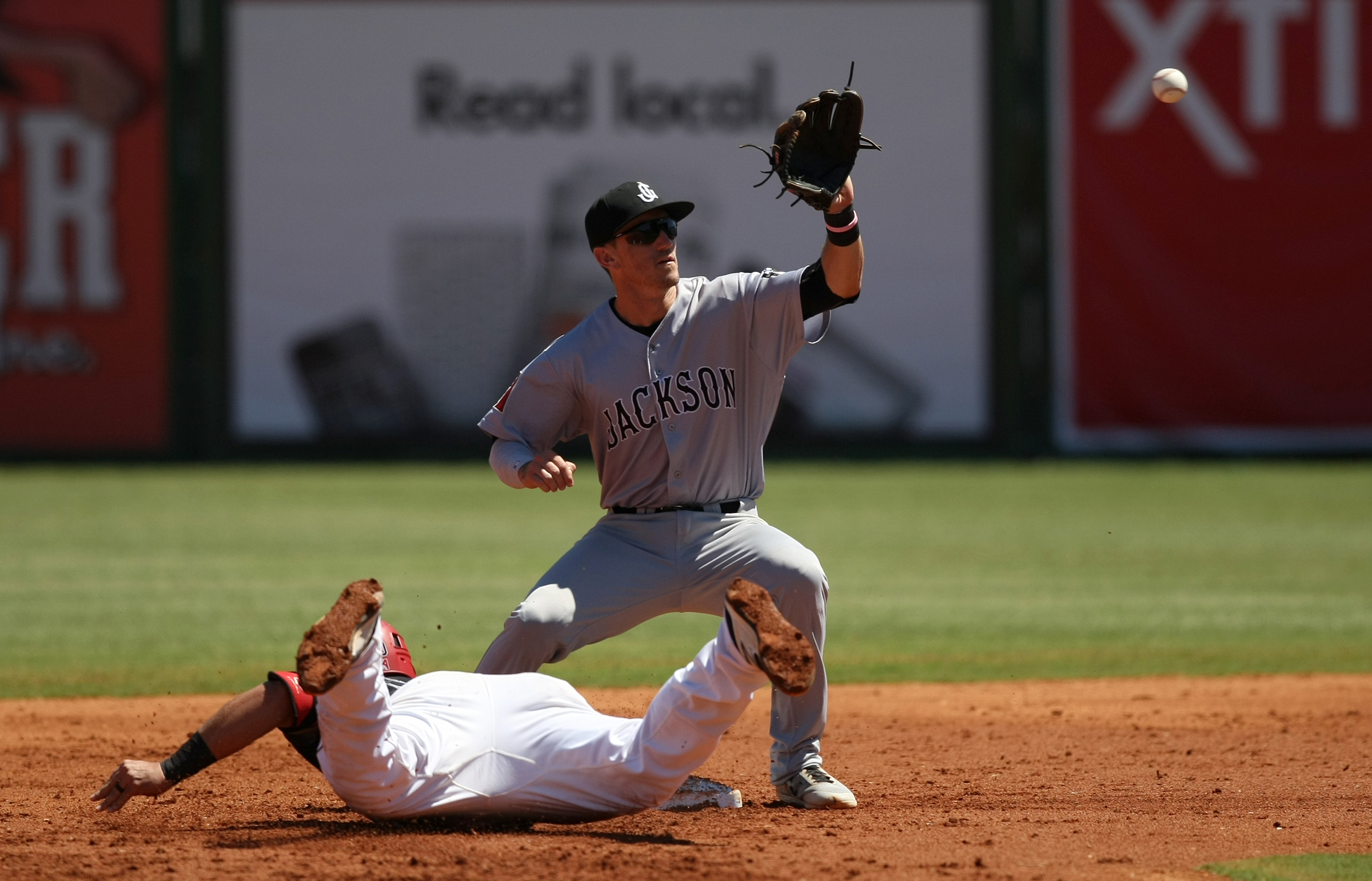 Chattanooga Lookouts designated hitter Jonathan Rodriguez (30) safely dives back to second before Jackson Generals second baseman Colin Walsh (8) can make the out in the bottom of the second inning at AT&T Field on Wednesday, June 7, in Chattanooga, Tenn.