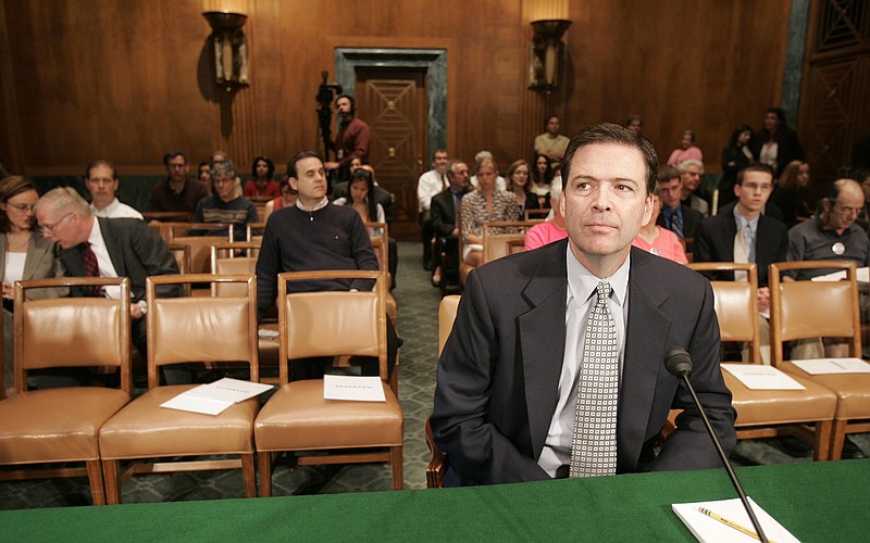 
              FILE - In this May 15, 2007, file photo, then-ormer Deputy Attorney General James Comey waits to testify on Capitol Hill in Washington, before the Senate Judiciary Committee hearing regarding the fired prosecutors. Comey's appearance June 8, 2017, before the Senate intelligence committee, during which he's expected to describe his encounters with President Donald Trump in the weeks before he was fired as FBI director, is one of the most anticipated congressional hearings in years. (AP Photo/Susan Walsh, File)
            