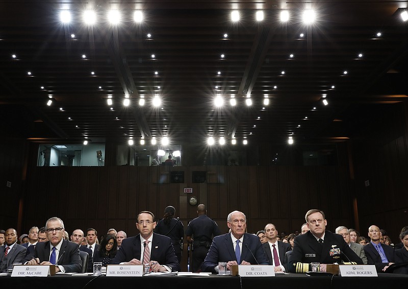 
              From left, Acting FBI Director Andrew McCabe, Deputy Attorney General Rod Rosenstein, National Intelligence Director Dan Coats, and National Security Agency Director Adm. Michael Rogers are seated during a Senate Intelligence Committee hearing about the Foreign Intelligence Surveillance Act, on Capitol Hill, Wednesday, June 7, 2017, in Washington. (AP Photo/Alex Brandon)
            