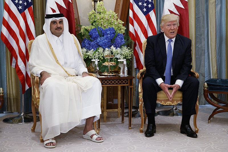 
              FILE -- In this May 21, 2017, file photo, President Donald Trump, right, holds a bilateral meeting with Qatar's Emir Sheikh Tamim Bin Hamad Al-Thani, in Riyadh, Saudi Arabia.  Trump sided with Saudi Arabia and other Arab countries Tuesday in a deepening diplomatic crisis with Qatar, appearing to endorse the accusation that the oil-rich Persian Gulf nation is funding terrorist groups.  (AP Photo/Evan Vucci, File)
            
