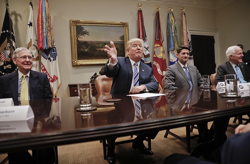 President Donald Trump, center, gestures during a meeting with House and Senate Leadership in the Roosevelt Room of the White House in Washington, Tuesday, June 6, 2017. With Trump are from left, Senate Majority Leader Mitch McConnell of Ky., House Speaker Paul Ryan of Wis., and Senate Majority Whip John Cornyn of Texas. (AP Photo/Pablo Martinez Monsivais)