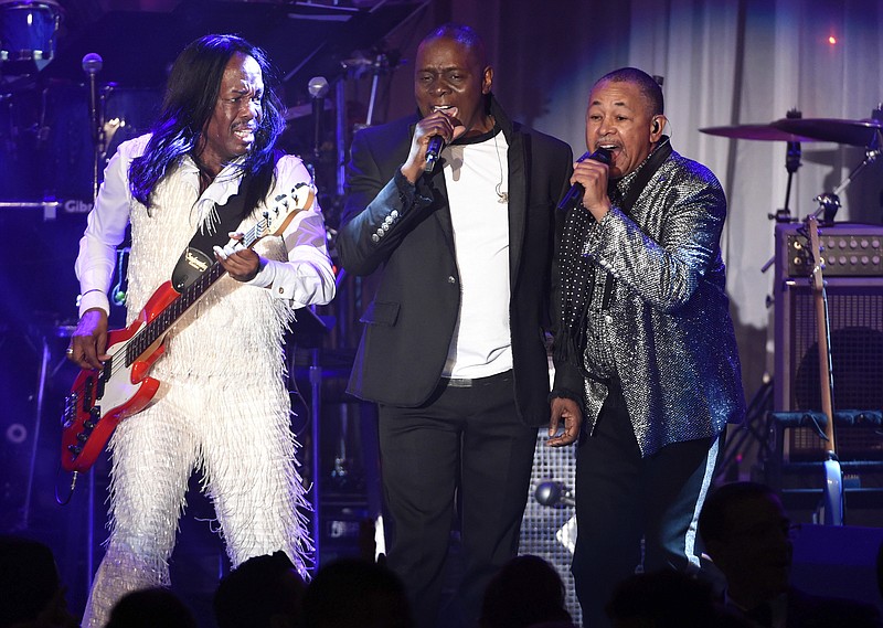 
              FILE - In this Feb. 14, 2016 file photo, Verdine White, from left, Philip Bailey and Ralph Johnson of Earth, Wind and Fire perform at the 2016 Clive Davis Pre-Grammy Gala in Beverly Hills, Calif. Earth, Wind & Fire will hit the road this summer with the band Chic featuring Nile Rodgers. Their tour starts July 12 in Oakland, Calif. (Photo by Chris Pizzello/Invision/AP, File)
            
