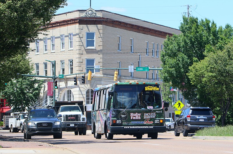 A shuttle bus travels along Market Street at King Street Wednesday, June 7, 2017, in Chattanooga, Tenn. This year marks the 25th anniversary of Carta's electric shuttle. 