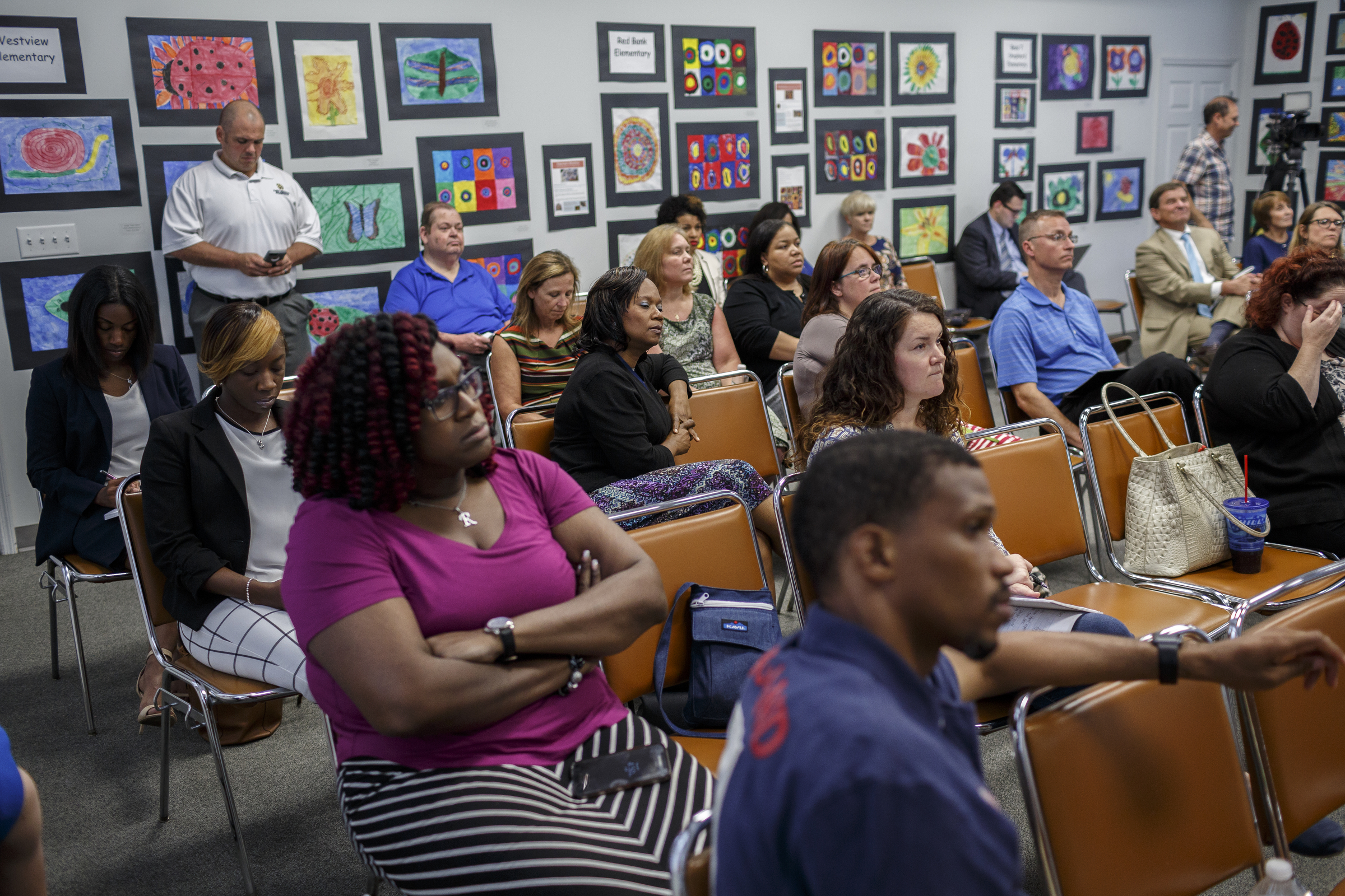 Members of the public listen as Hamilton County Schools superintendent candidate Dr. Bryan Johnson speaks during a meet-and-greet in the Board of Education meeting room on Thursday, June 8, 2017, in Chattanooga, Tenn. Dr. Johnson is the fourth of five candidates to interview for the position.