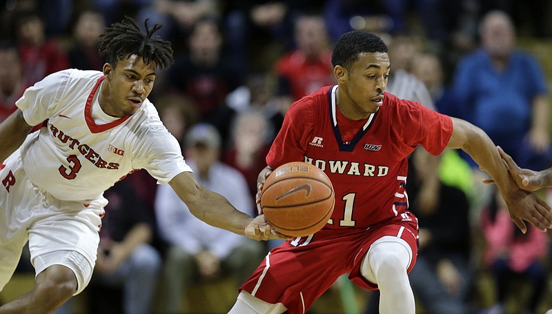 James Daniel III dribbles away from Rutgers' Corey Sanders during a road game for Howard University in November 2015. Daniel is a graduate transfer who will play for Tennessee this season.