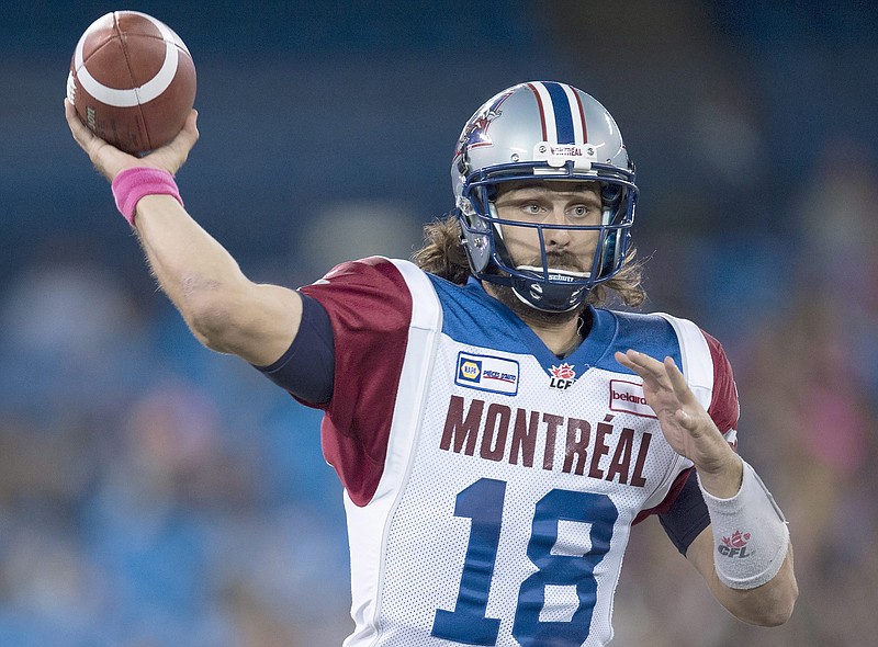 Former Montreal Alouettes quarterback Jonathan Crompton launches a pass against the Toronto Argonauts during the first half CFL game in Toronto on Saturday, Oct. 18, 2014. (AP Photo/The Canadian Press, Frank Gunn)