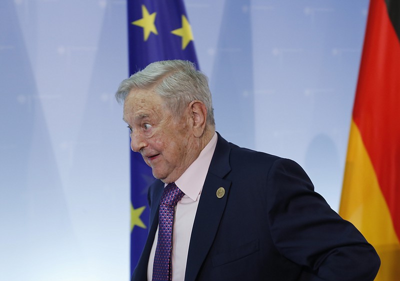 
              Hungarian-American investor George Soros leaves after a press conference prior to the launch event for the European Roma Institute for Arts and Culture at the Foreign Ministry in Berlin, Germany, Thursday, June 8, 2017. (AP Photo/Ferdinand Ostrop)
            