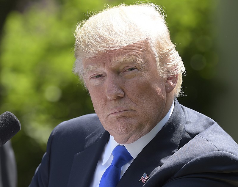 
              President Donald Trump listens during a news conference with Romania's President Klaus Werner Iohannis in the Rose Garden of the White House in Washington, Friday, June 9, 2017. (AP Photo/Susan Walsh)
            