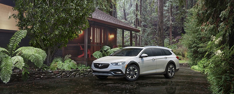 
              This photo provided by General Motors Company shows the 2018 Buick Regal Tour X. Under the hood, every Regal Tour X will be motivated by GM's familiar 2.0-liter turbocharged four-cylinder engine, rated at 250 horsepower and 295 pound-feet of torque in this application. In a nod to rugged rivals such as the Audi Allroad and Subaru Outback, all-wheel drive will come standard as will crossover-inspired plastic wheel arches and a little extra ground clearance. (Courtesy of General Motors Corporation via AP)
            