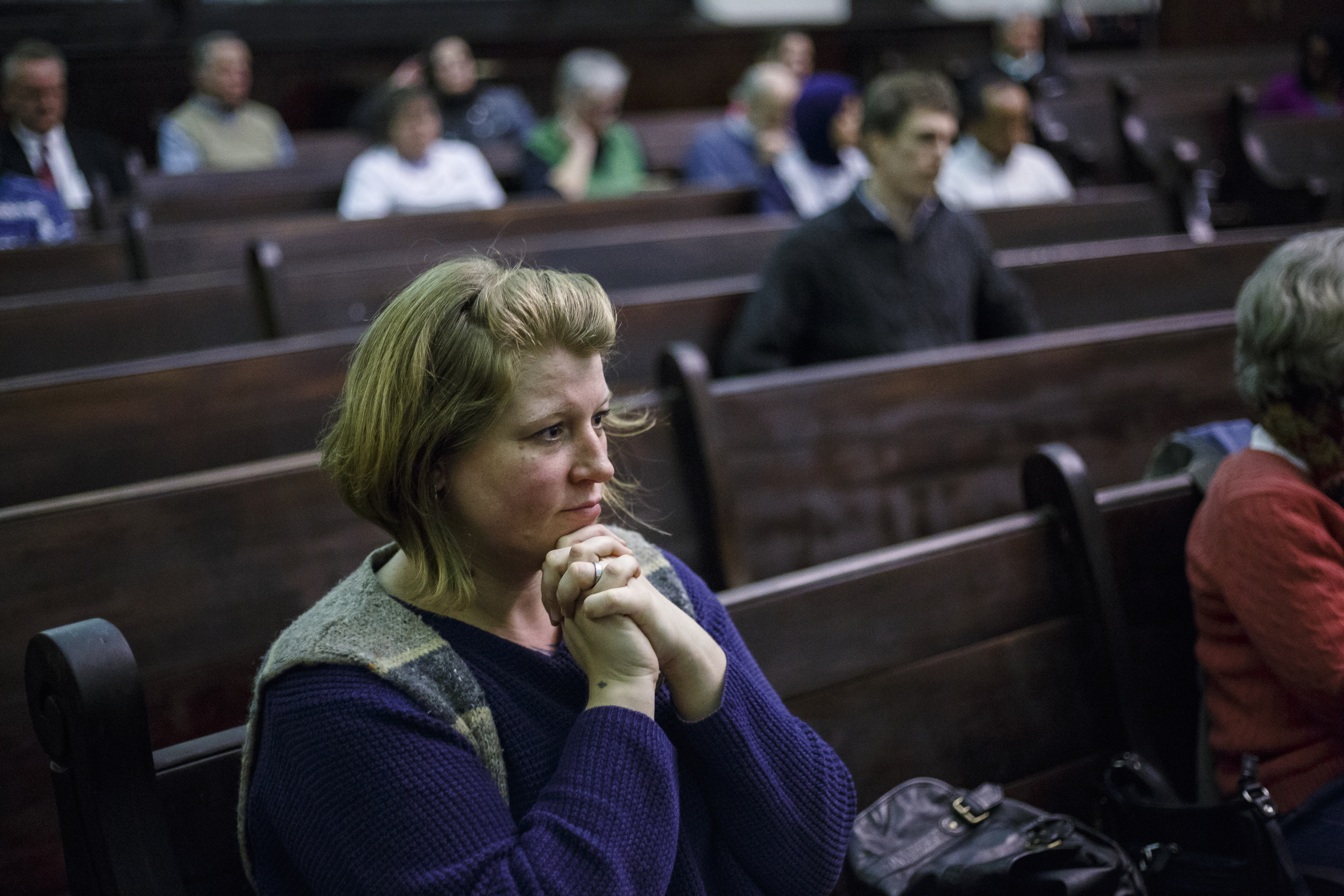 Khristy Wilkinson listens to a speaker during an interfaith celebration in honor of Dr. Martin Luther King, Jr., at Mercy Junction Justice & Peace Center on Tuesday, Jan. 10, 2017, in Chattanooga, Tenn. The celebration is the first of five days of events to honor the late Dr. King.