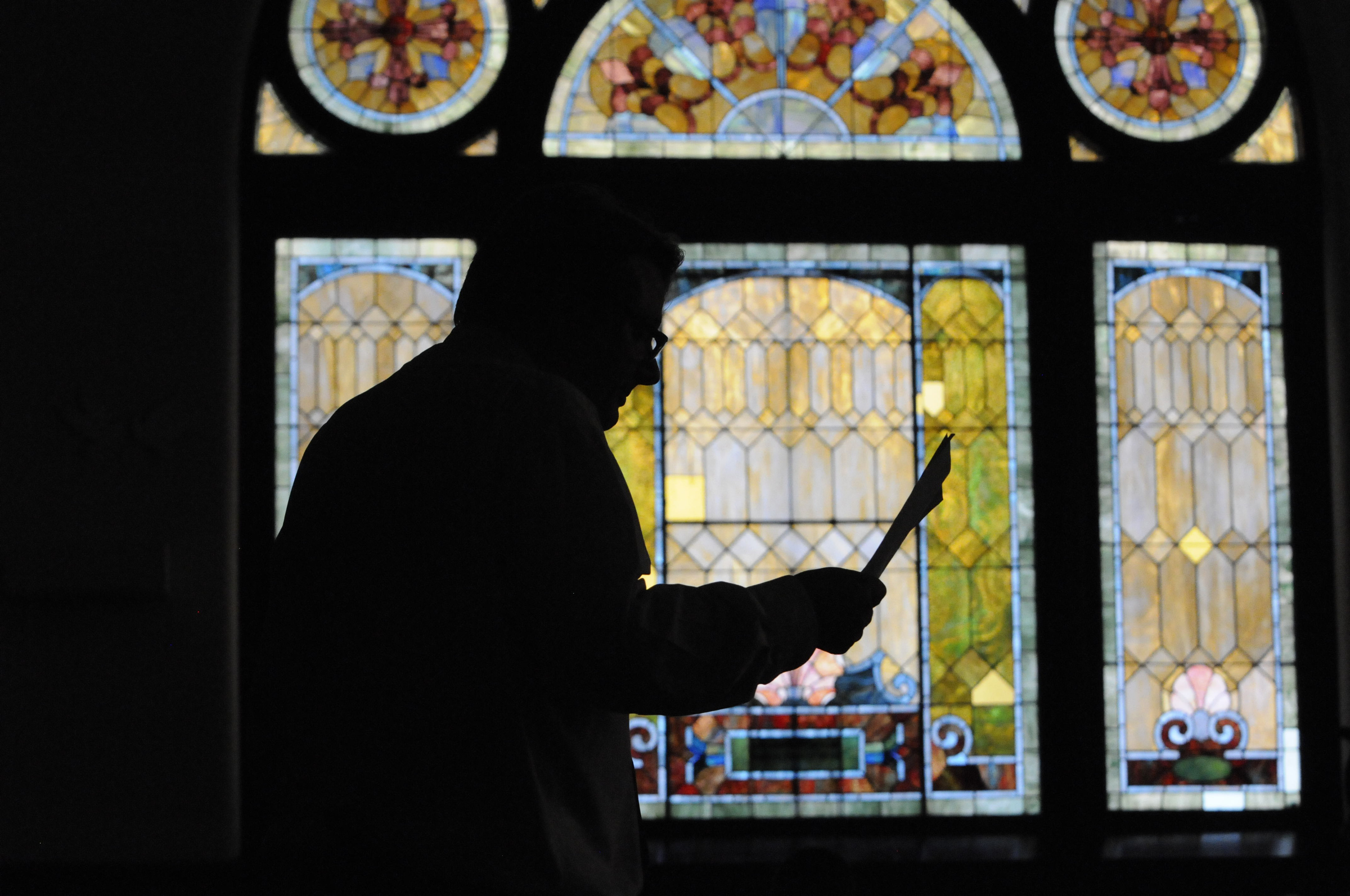 Rev. Brian Merritt leads a group of staff and volunteers in a Presbyterian Confessional Thursday evening in the sanctuary at Mercy Junction Justice and Peace Center at St. Andrews on Union Avenue. Merritt began reading from Psalms 13.