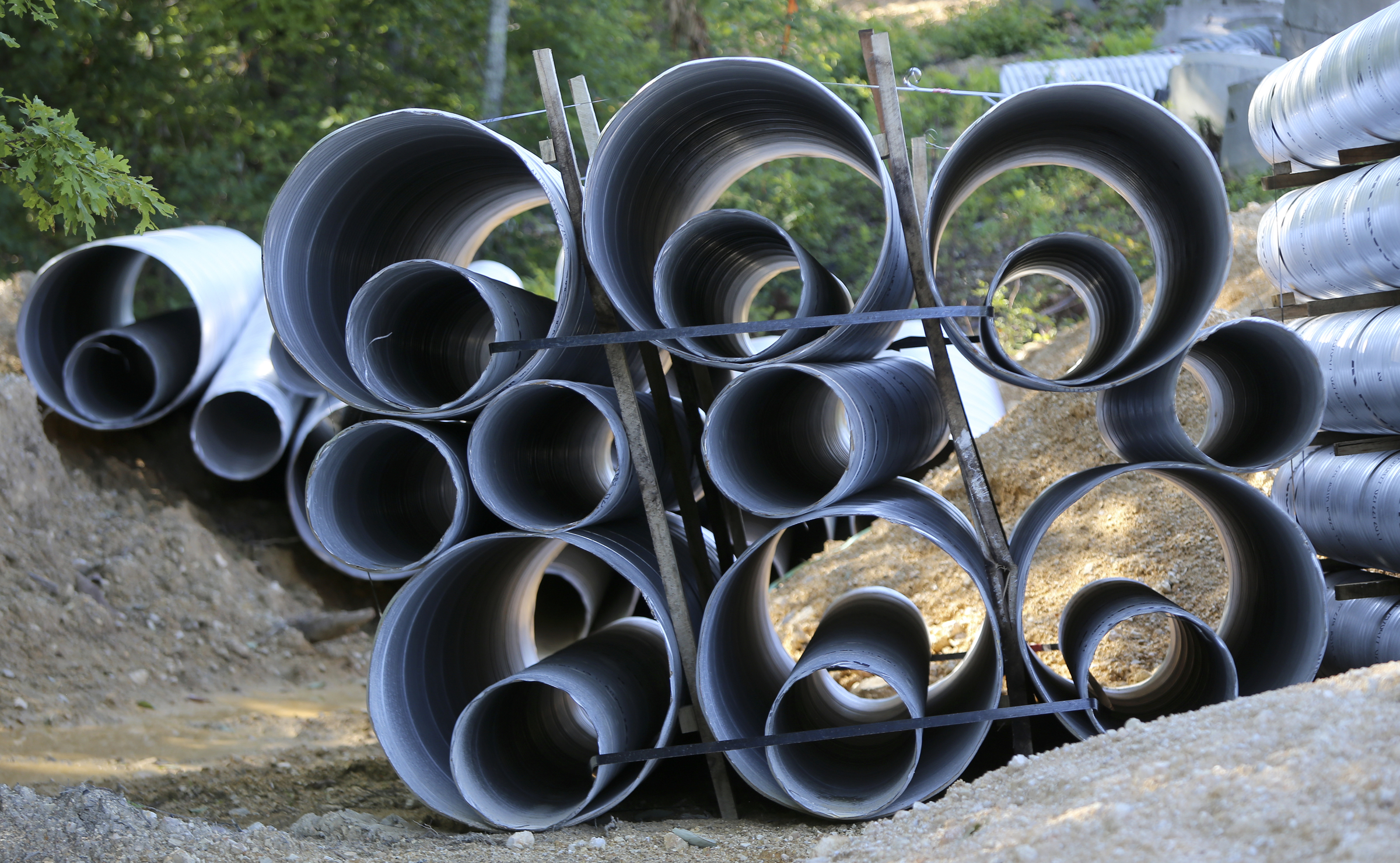 Piping is seen on an undeveloped part of the Hamilton on Hunter subdivision on Friday, June 9, in Harrison, Tenn.