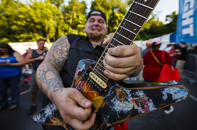 Lead guitarist Cody Hyde performs with The Band Antle from in the crowd on the second night of the Riverbend Festival at Ross's Landing on Saturday, June 10, 2017, in Chattanooga, Tenn. Hip hop artist Ludacris headlined the evening.