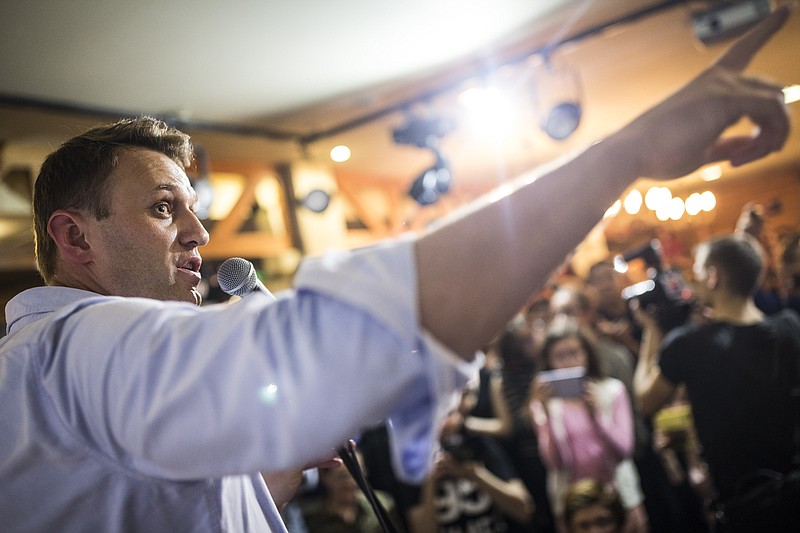 
              In this photo taken on Friday, June 9, 2017, Russian opposition leader Alexei Navalny gestures while speaking to people in the city of Perm, about 1200 kilometers (750 miles) east of Moscow, Russia. Russian opposition leader Alexei Navalny has called for anti-Kremlin protests on June 12, and activists in about 200 cities and towns are expected to turn out and demonstrate against government corruption. (Evgeny Feldman/Pool Photo via AP)
            