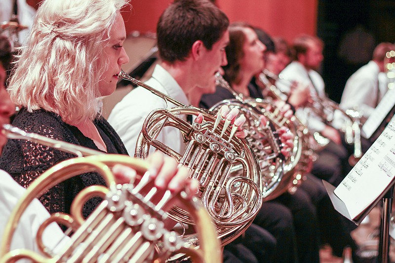 The French horn section rehearses.