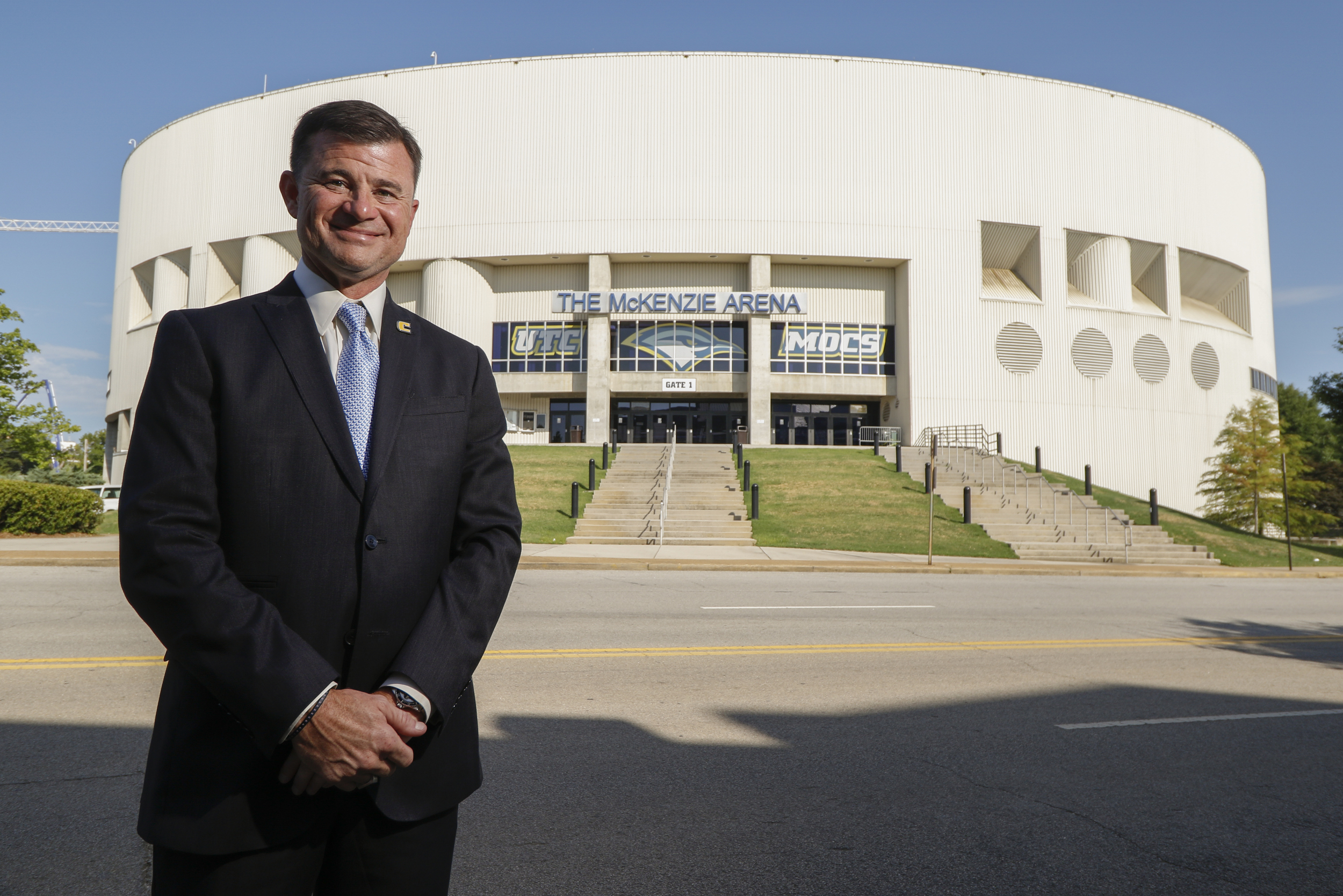 Staff Photo by Dan Henry / The Chattanooga Times Free Press- 7/14/16. David Blackburn, Vice Chancellor and Director of Athletics for The University of Tennessee at Chattanooga, stands in front of McKenzie Arena where his office is located.