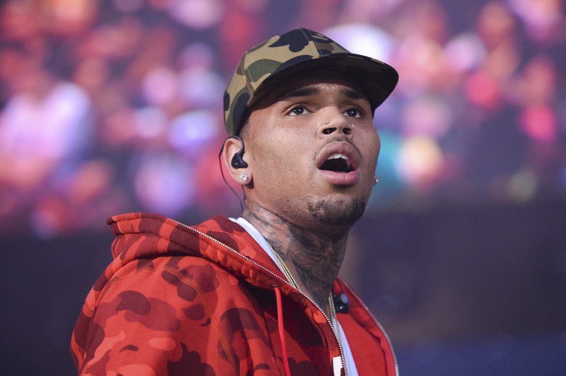 
              FILE - In this June 7, 2015 file photo, rapper Chris Brown performs at the 2015 Hot 97 Summer Jam at MetLife Stadium in East Rutherford, N.J. Brown, DJ Khaled, Lil Wayne and New Edition have been added as performers at the BET Awards on June 25 at the Microsoft Theater in Los Angeles. (Photo by Scott Roth/Invision/AP, File)
            