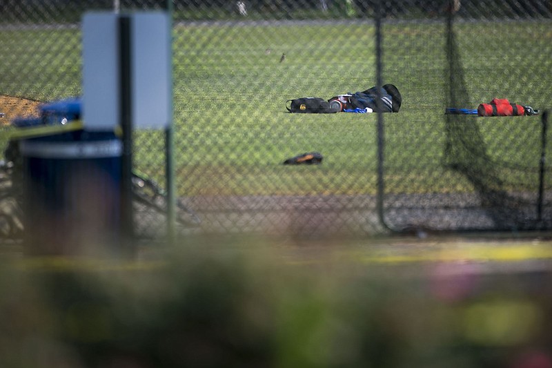 Baseball equipment was left on the field at the scene of a shooting at Eugene Simpson Stadium Park, in Alexandria, Va., on Wednesday. The shooting, at a baseball field where members of a congressional team regularly practice, left several injured, including House Majority Whip Steve Scalise, R-La.