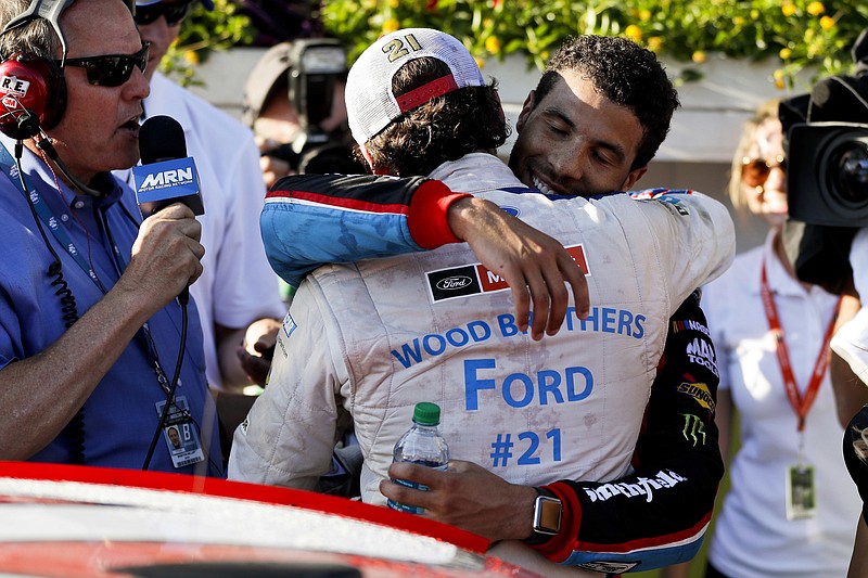 Darrell "Bubba" Wallace Jr., right, greets Ryan Blaney in victory lane Sunday at Pocono Raceway in Long Pond, Pa.. Blaney won the race for his first Cup Series race victory, while Wallace became just the eighth black driver to compete in NASCAR's top series.