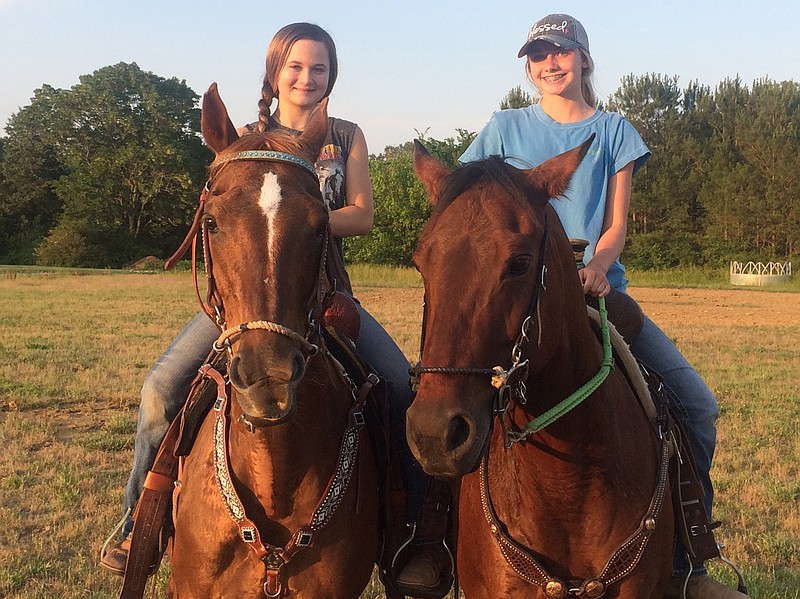 Cousins Bree Roark, left, and Sierra Holder from Georgetown — on Cattin and Jolene, respectively — will be competing in the World's Largest Junior High School Rodeo next week in Lebanon, Tenn.
