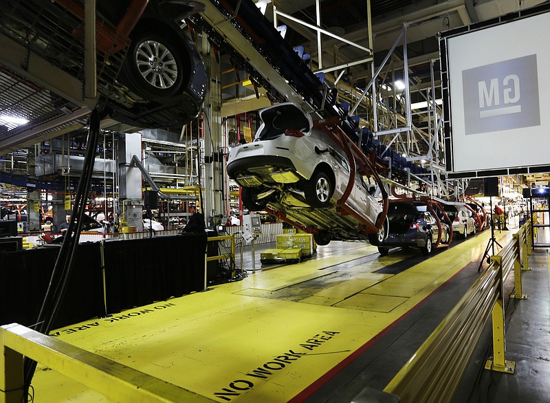 
              FILE - In this Monday, Jan. 28, 2013, file photo, cars move along an assembly line at the General Motors Fairfax plant in Kansas City, Kan. General Motors is extending the normal two-week summer shutdown at two U.S. car factories because of slumping demand. Union officials say the Lordstown, Ohio, plant near Cleveland and the Fairfax plant in Kansas City, Kan., will close for as long as five weeks in June and July 2017. (AP Photo/Orlin Wagner, File)
            