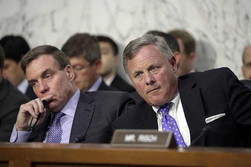 Sen. Richard Burr, R-N.C., right, chairman of the Senate Select Committee on Intelligence, and Vice Chairman Mark Warner, D-Va., left, listen as Attorney General Jeff Sessions testifies before the Senate Select Committee on Intelligence about his role in the firing of FBI Director James Comey and the investigation into contacts between Trump campaign associates and Russia, on Capitol Hill in Washington, Tuesday, June 13, 2017. (AP Photo/J. Scott Applewhite)

