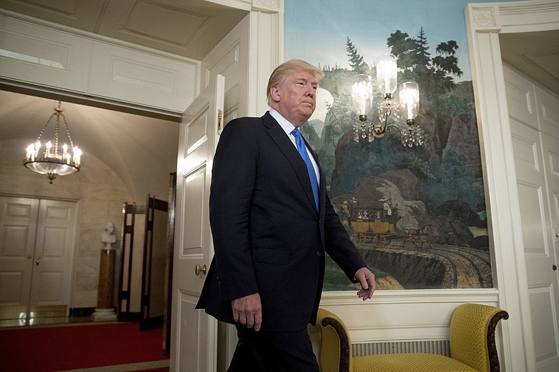 
              President Donald Trump arrives in the Diplomatic Room of the White House in Washington, Wednesday, June 14, 2017, to talk about the shooting in Alexandria, Va. where House Majority Whip Steve Scalise of La., and others, where shot during a Congressional baseball practice. (AP Photo/Andrew Harnik)
            