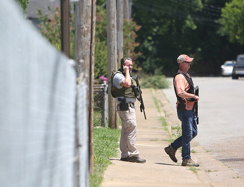 Law enforcement works the scene after a shooting that was called in at 12:30 p.m. Thursday, June 15, 2017, at O'Neal Street about halfway between Cleveland Avenue and Blackford Street in Chattanooga, Tenn. Upon arrival, the Chattanooga Police Department found one male shot and was transported to a local hospital and determined to be in critical condition. 