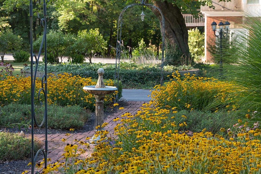 Tranquil gardens lead visitors to the Gerald entrance of Mercersburg Inn.