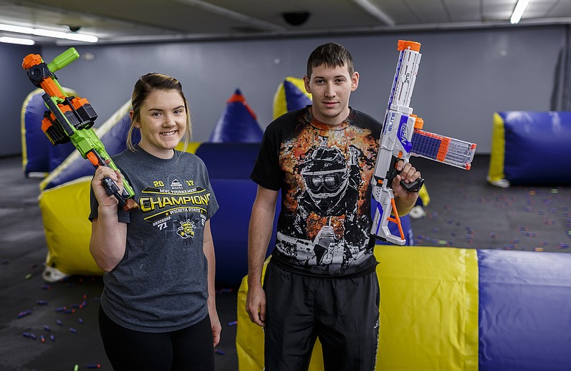 Owners Corey Hipp, right, and his wife Allison Hipp are photographed in their business Dart Town Arena on Lee Highway on Wednesday, June 14, 2017, in Chattanooga, Tenn. The foam dart-gun arena, which has rules similar to paintball, holds its grand opening on Saturday.