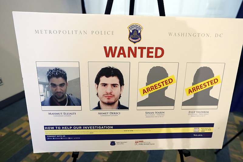 
              Pictures of people facing criminal charges are seen after a news conference in Washington, Thursday, June 15, 2017, about an May 16, 2017, altercation outside the Turkish Embassy in Washington during the visit of the Turkish president. Police say they've issued arrest warrants for a dozen Turkish security agents and two others accused of taking part in a violent altercation May 16 as Turkey's president visited Washington. (AP Photo/Alex Brandon)
            