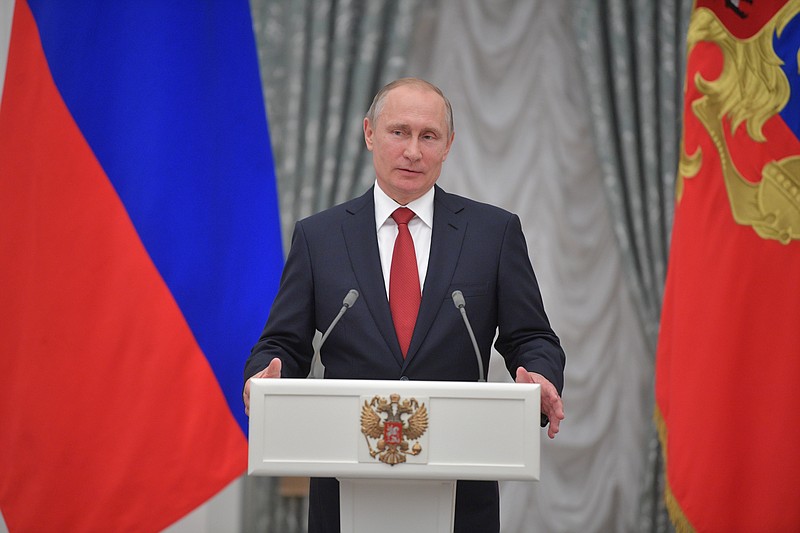 
              Russian President Vladimir Putin speaks during a ceremony of receiving passports by ten young Russians in Moscow's Kremlin, Russia, Monday, June 12, 2017. (Alexei Druzhinin/Sputnik, Kremlin Pool Photo via AP)
            