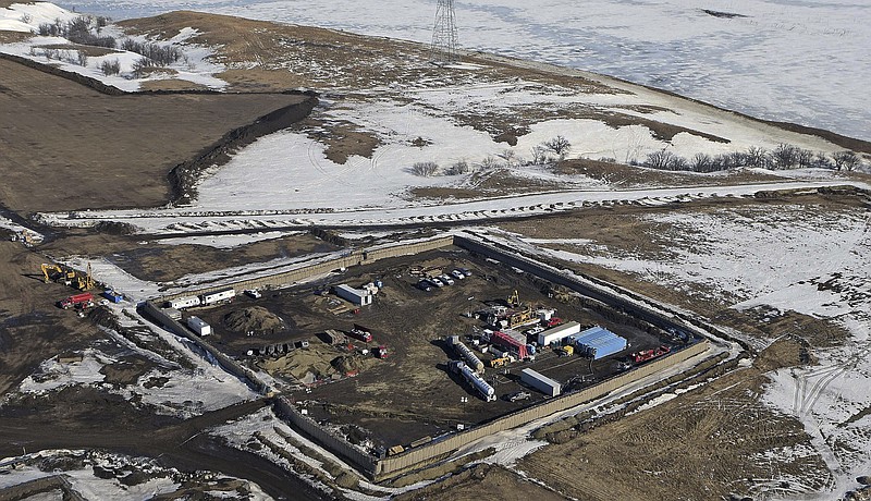 
              FILE- This Feb. 13, 2017, file aerial photo shows a site where the final phase of the Dakota Access Pipeline will take place with boring equipment routing the pipeline underground and across Lake Oahe to connect with the existing pipeline in Emmons County in Cannon Ball, N.D. A federal judge has handed a lifeline to efforts to block the pipeline, ruling Wednesday June 14, that the U.S. Army Corps of Engineers didn't adequately consider the possible impacts of an oil spill where the pipeline passes under the Missouri River. (Tom Stromme /The Bismarck Tribune via AP, File)
            